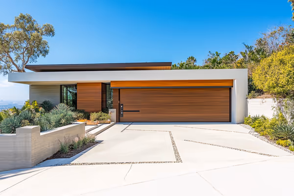 A modern garage door with advanced security features, complementing a contemporary home design with sleek lines.