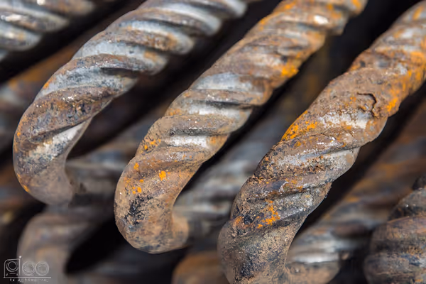 A close-up of garage door springs with wear and tear marks showcasing typical signs of maintenance needs.
